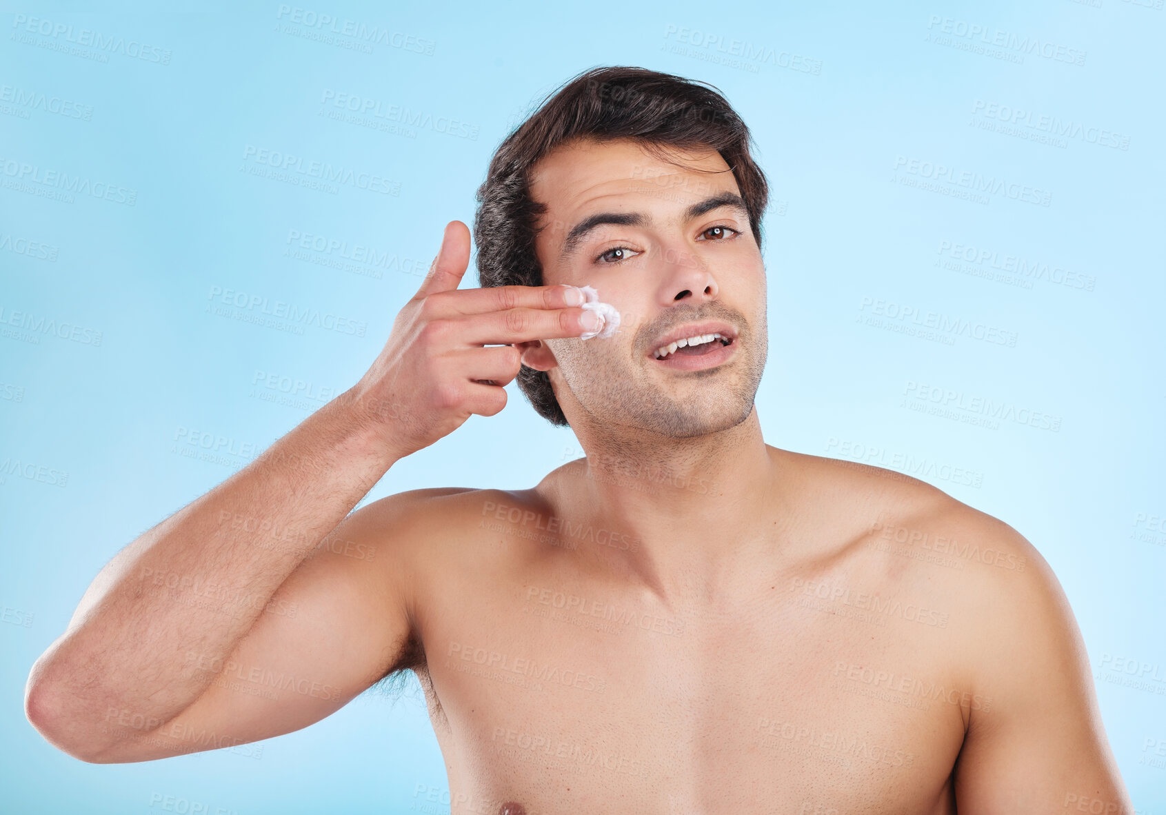 Buy stock photo Skincare, portrait and cream product in studio with natural cosmetics for dermatology routine in morning for clear soft skin. Person, blue background and moisturizer for grooming, hygiene and fresh.