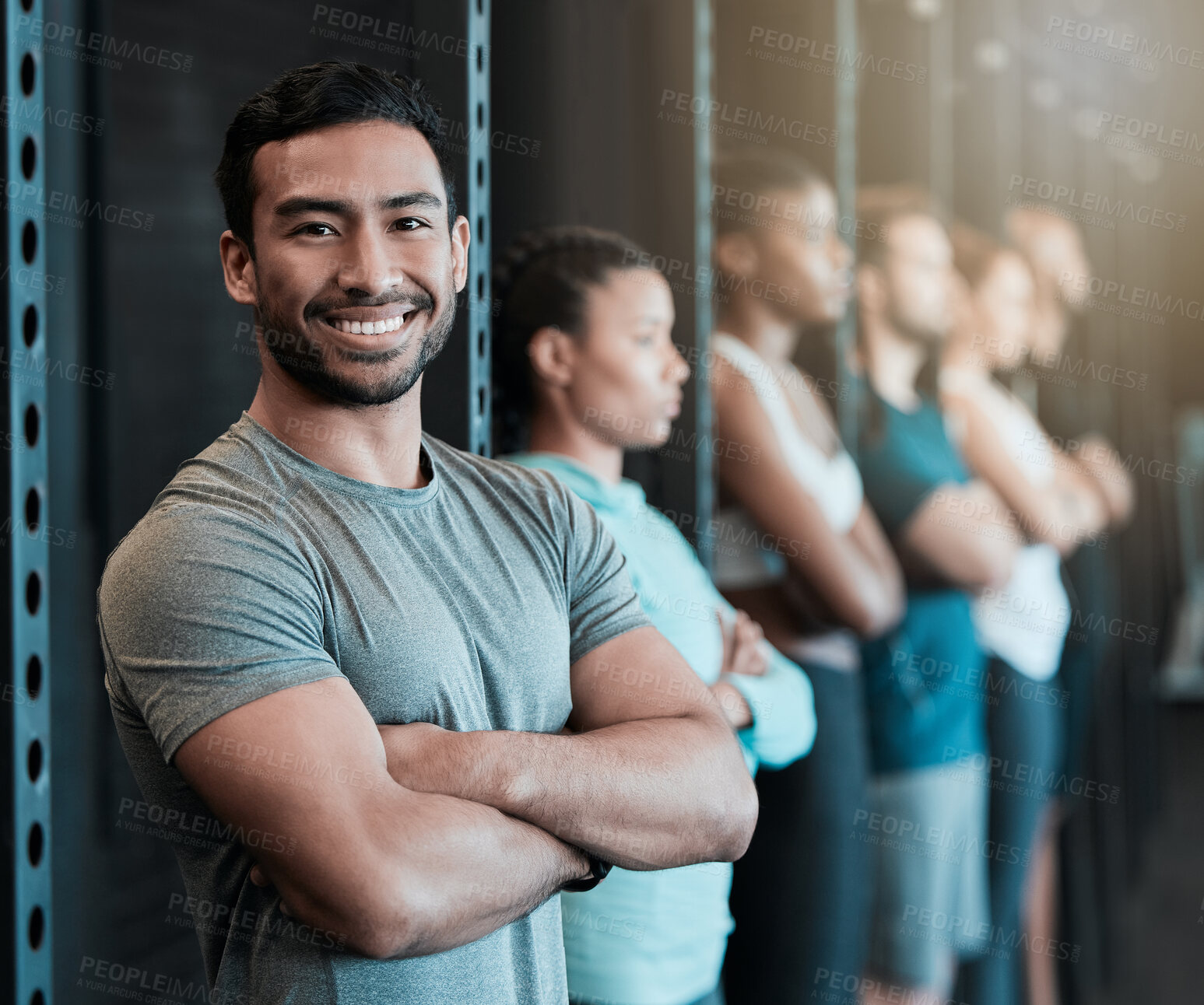 Buy stock photo Fitness, gym and happy man in row for portrait, confidence or ready for workout in class. Arms crossed, personal trainer or smile in training center for exercise, wellness or determination for growth