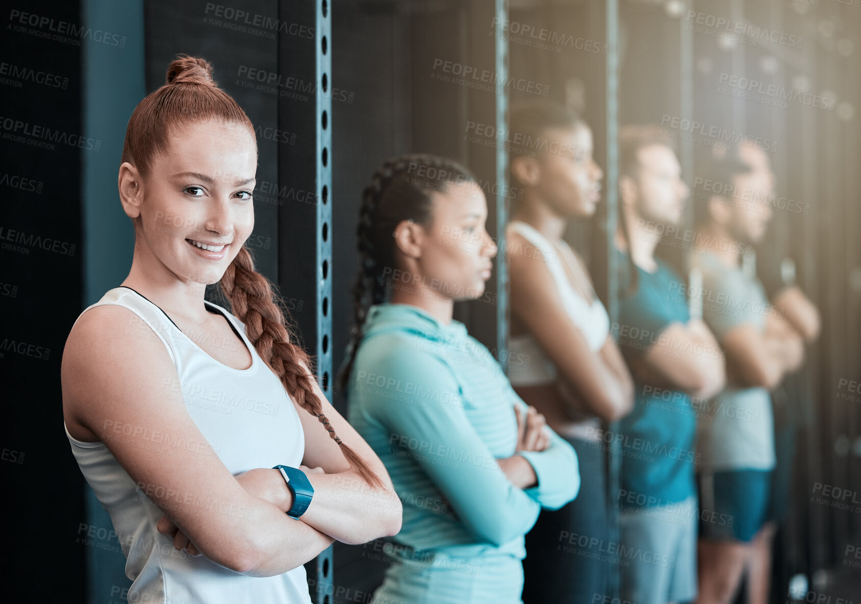 Buy stock photo Fitness, gym and woman in row for portrait, confidence and ready for workout in class. Arms crossed, athlete and smile in training center for exercise, wellness or determination for growth with group