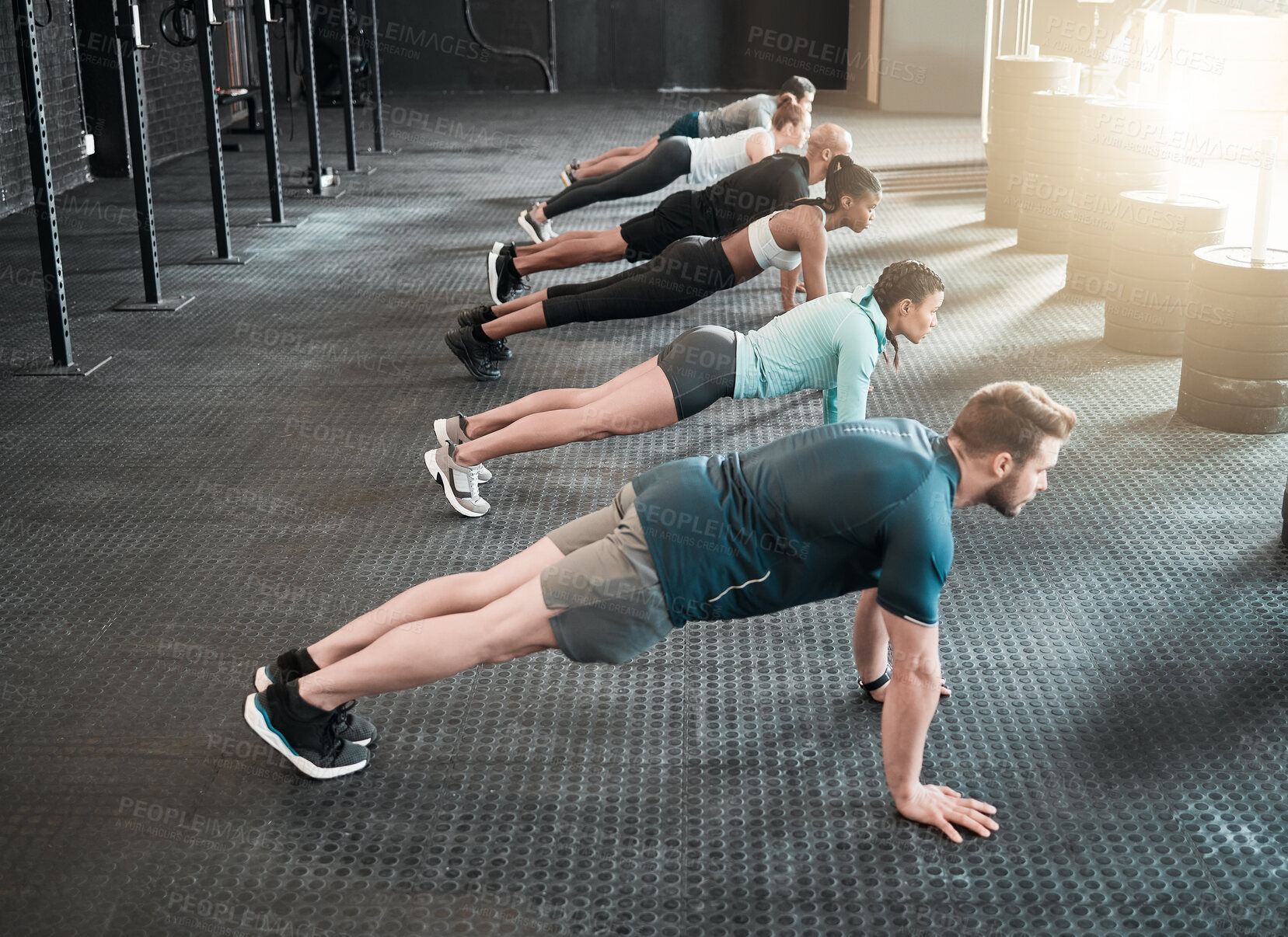 Buy stock photo Shot of a group of friends planking together