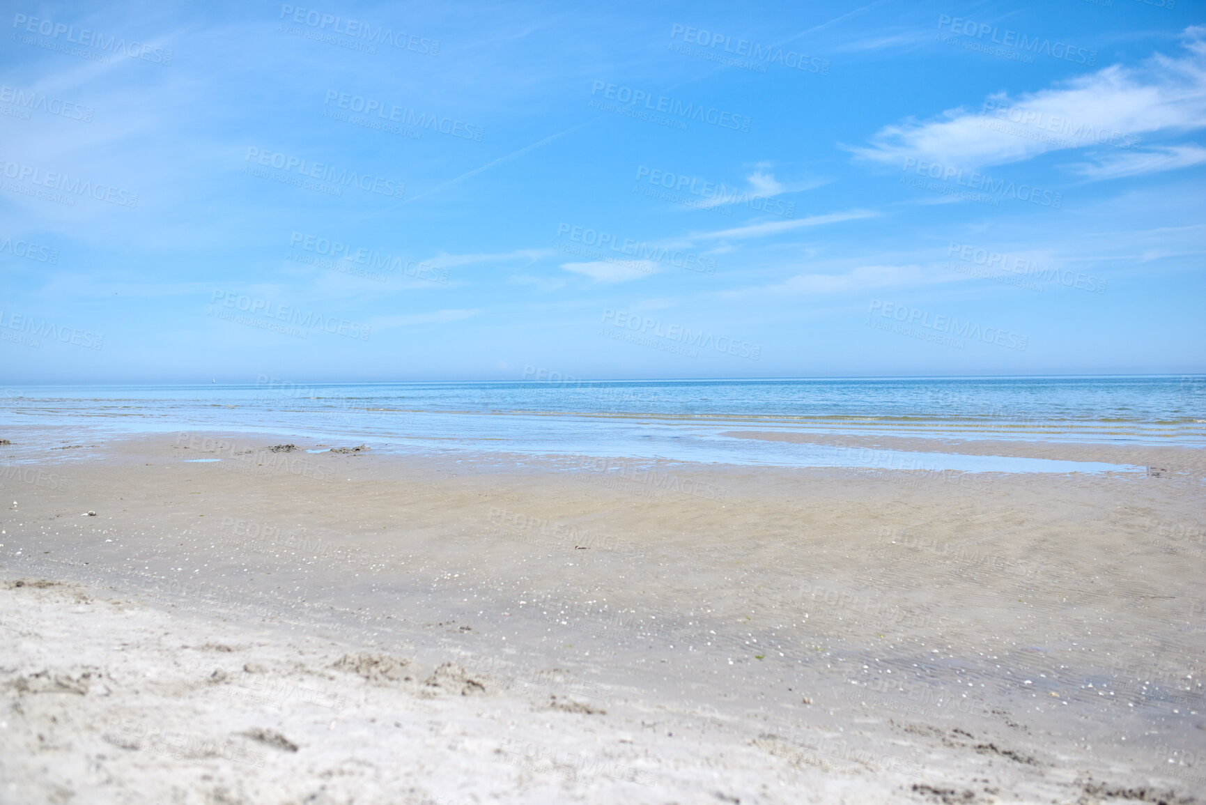 Buy stock photo Beautiful, natural and landscape view of the beach and blue sky over the horizon with copy space. A peaceful and calm scene of endless sandy water of the sea or ocean at low tide during the day