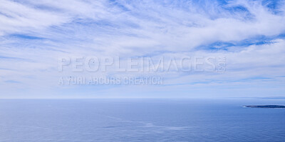 Buy stock photo Beautiful, calm and quiet view of the ocean and clouds in blue sky with a small tropical island and copy space background. Landscape of a cloudy atmosphere and climate in a natural ocean environment
