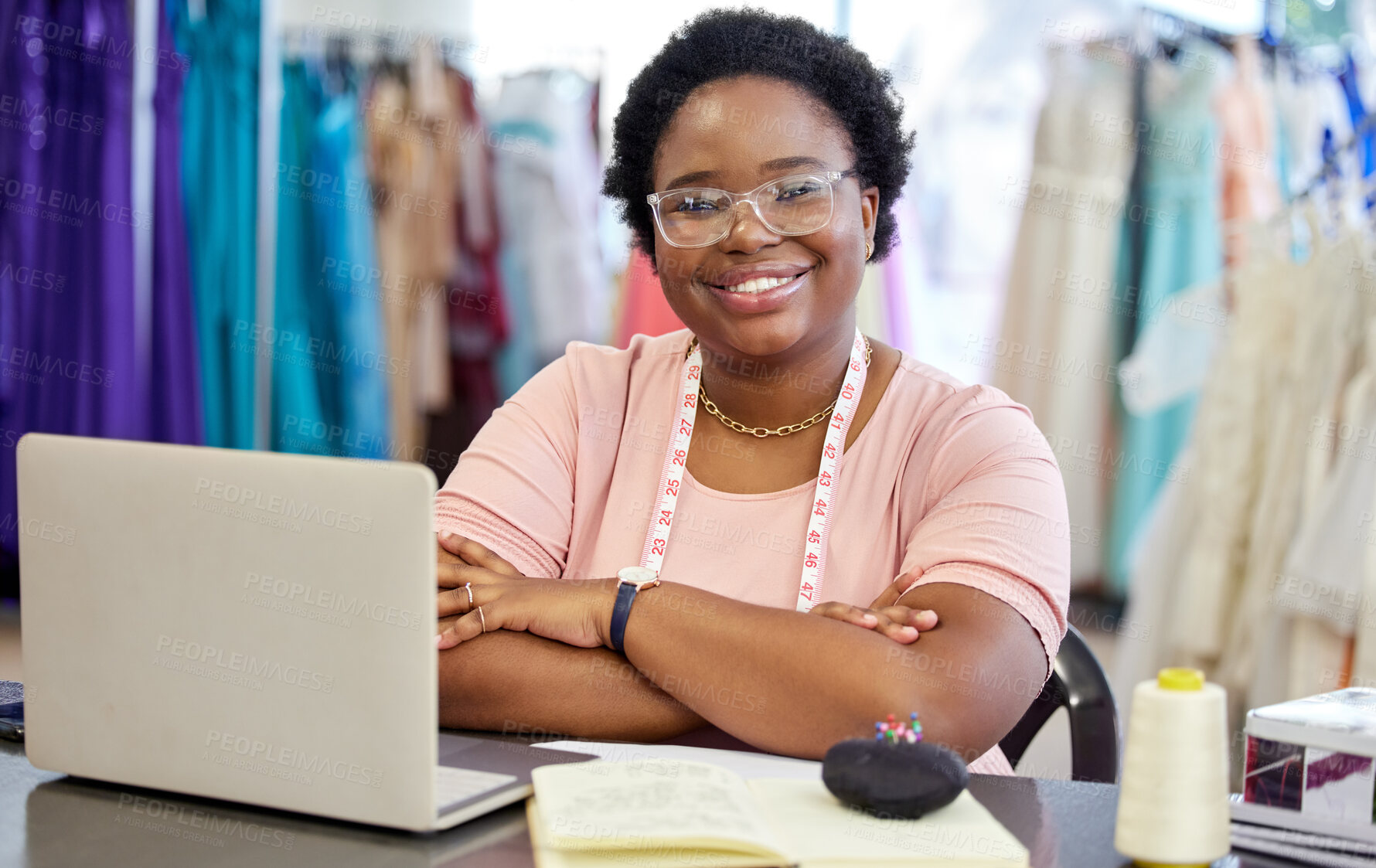 Buy stock photo Fashion designer, laptop and portrait of black woman in workshop for online order, planning or clothing collection. Creative, tech and person with tape measure for seamstress, sketch or tailor