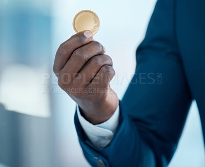 Buy stock photo Shot of a businessman holding a bitcoin in a modern office