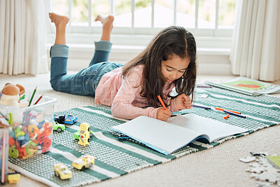 Buy stock photo Child, notebook and writing in home on floor with creativity, education and school assignment. Young girl, notes and drawing for learning, development and student project for class and homework