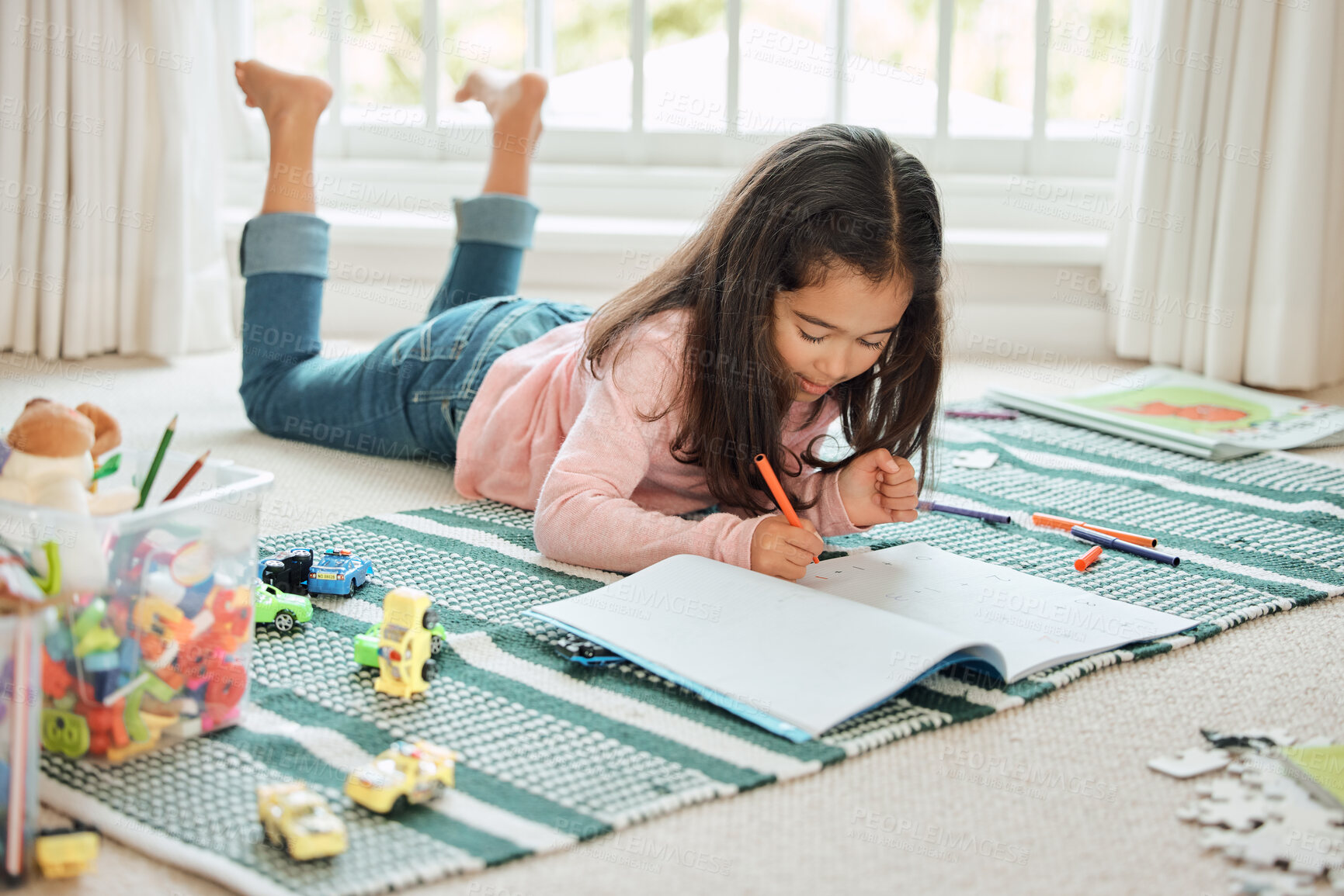 Buy stock photo Child, notebook and writing in home on floor with creativity, education and school assignment. Young girl, notes and drawing for learning, development and student project for class and homework