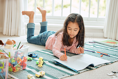 Buy stock photo Shot of a little girl doing homework at home