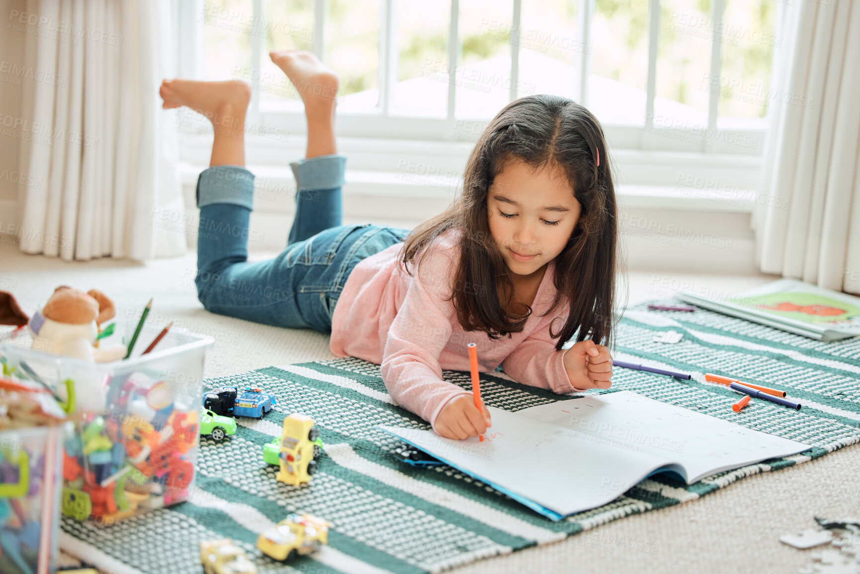 Buy stock photo Shot of a little girl doing homework at home