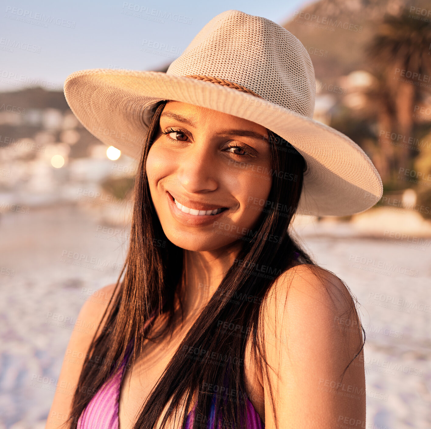 Buy stock photo Woman, portrait and beach smile at sunset or holiday vacation, tropical ocean break or happy travel. Indian person, face and tip destination in evening or summer sunshine in peace relax, hat for rest