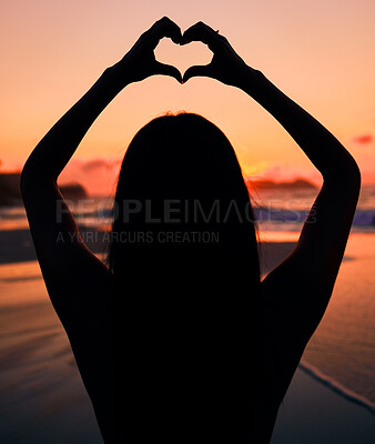 Buy stock photo Woman, silhouette and sunset by sea with heart hands for love, care and kindness with sign, summer and dusk. Girl, person and ocean with symbol, emoji or icon on vacation, beach and outdoor in dark