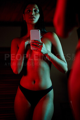 Buy stock photo Shot of a beautiful young woman taking a topless selfie