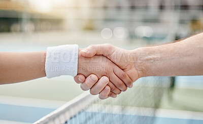 Buy stock photo Cropped shot of two unrecognizable tennis players shaking hands while standing outside on a court