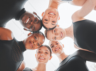 Buy stock photo Shot of a group of ballet dancers standing together in a huddle