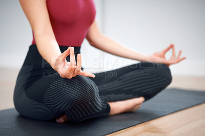 Buy stock photo Shot of a woman in the lotus pose during a yoga class