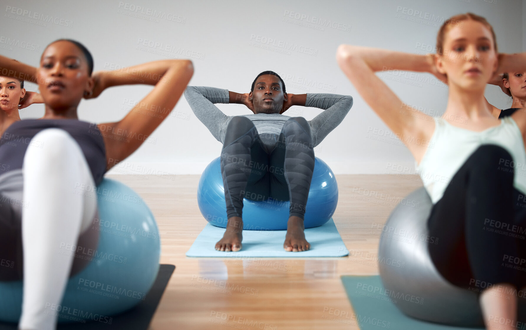 Buy stock photo Ball, class and group for crunch exercise in gym, diversity and together for pilates training. People, strong abdomen and fitness in studio for wellness, core challenge and trainer for muscle routine