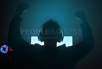 Buy stock photo Man in dark room, silhouette with video game and winning, fist pump and online streaming with gaming competition. Esports, cyber and male streamer back, celebrate win for gamer tournament and success