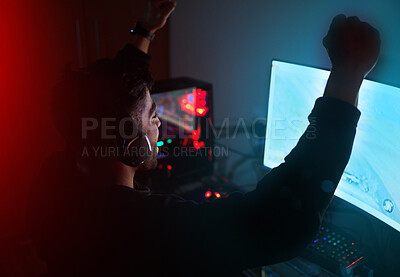 Buy stock photo Man in dark room, video game win with fist pump and online streaming, gaming competition and esports on computer. Achievement, cyber and male streamer celebrate winning gamer tournament with success