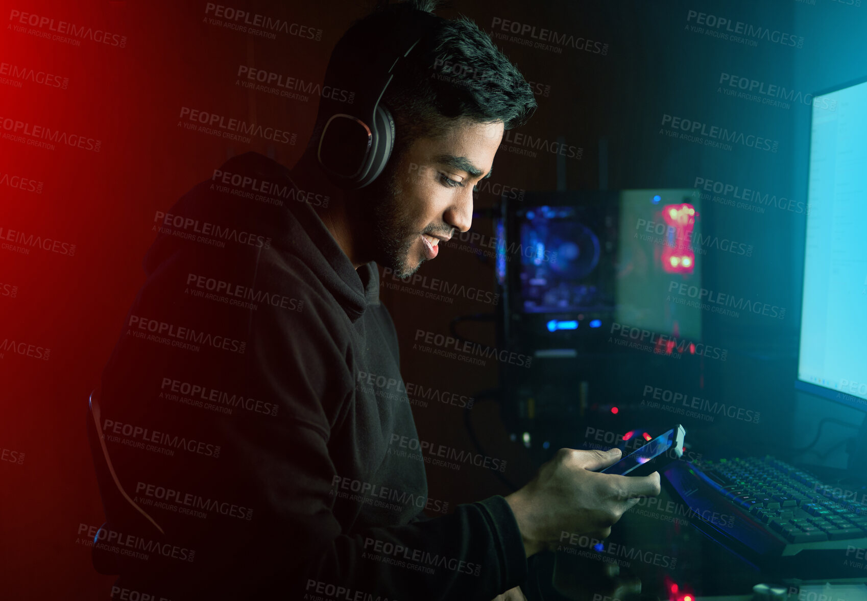 Buy stock photo Gamer, man and texting with phone with in night, smile or reading for invitation link to rpg contest. Person, smartphone and pro gaming with chat, challenge and esports app by computer in dark home