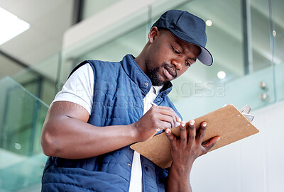 Buy stock photo Shot of a man delivering a package in a building