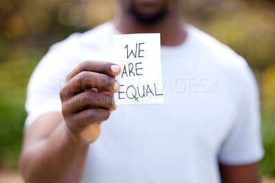 Buy stock photo Man, hand and card with message for protest, equality or human rights in outdoor nature. Closeup of male person or activist showing note for campaign, community or freedom in democracy or politics