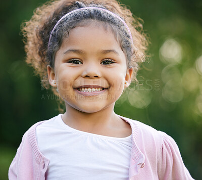 Buy stock photo Child, portrait and happy in playground, backyard or park for fun, joy and development as kid. Girl, toddler and positive in outdoor for growth, curiosity and weekend in garden for adventure as youth