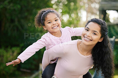 Buy stock photo Mother, girl and piggyback portrait in outdoor, love and stretching arms for flying game in nature. Mom, daughter and carrying support in countryside on holiday, bonding and kid for fun in garden