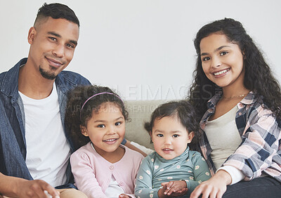 Buy stock photo Happy family, portrait and relax in home together, trust and love in relationship connection. Parents, children and girls on couch in living room on weekend in Indonesia, support and care on sofa