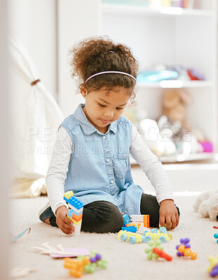 Buy stock photo Girl, toys and playing in house for development, learning and childhood growth with building blocks. Child, fun and games in home for coordination skills, creativity and preschool activity on floor