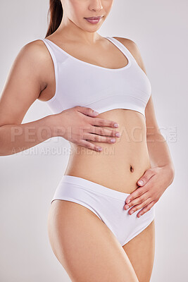 Buy stock photo Cropped shot of a fit young woman posing in her underwear