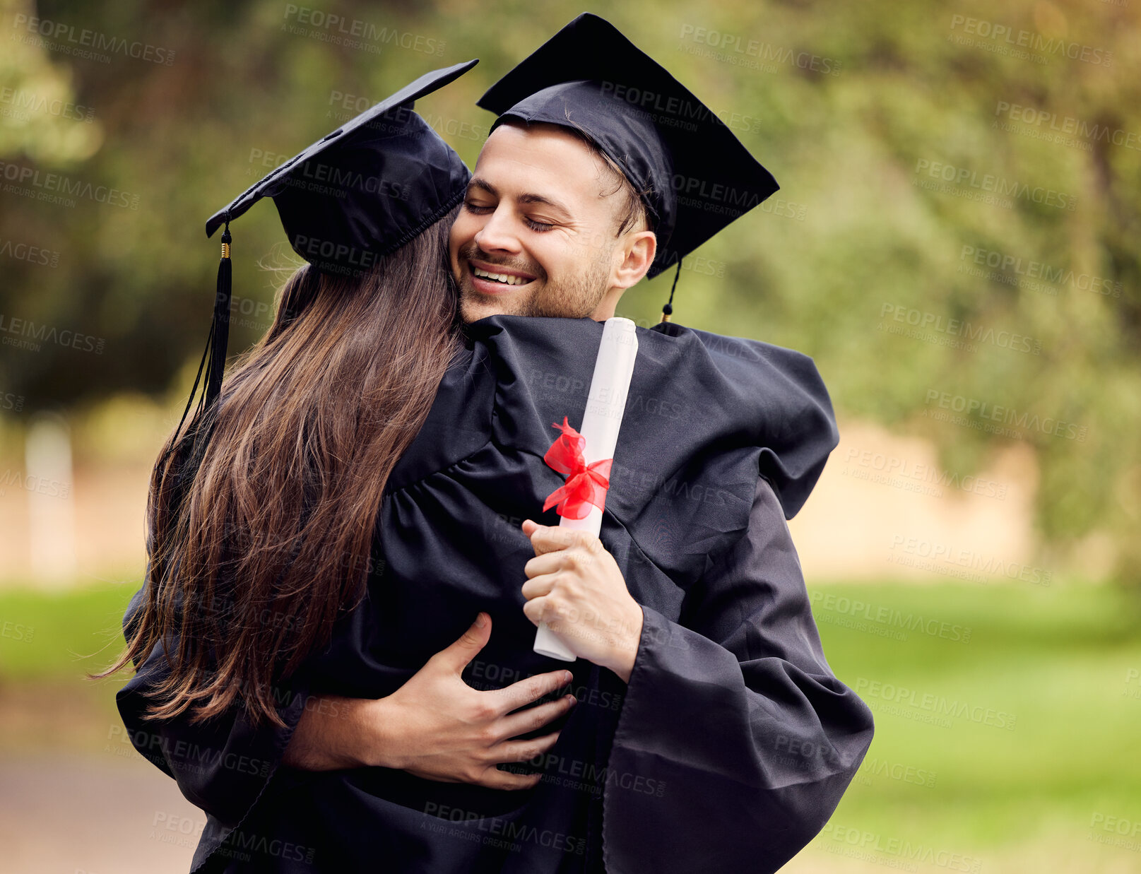 Buy stock photo Graduation, success and friends hugging outdoor on university campus at a celebration event. Education, certificate and hug with happy scholarship students cheering together as college graduates