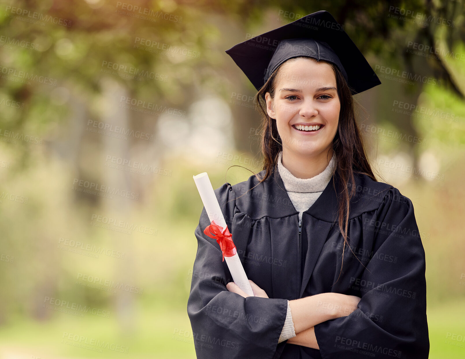 Buy stock photo Graduation, diploma and portrait of university woman with arms crossed for education, achievement or success ceremony. Student, bokeh and person with certificate for satisfaction, happiness or event