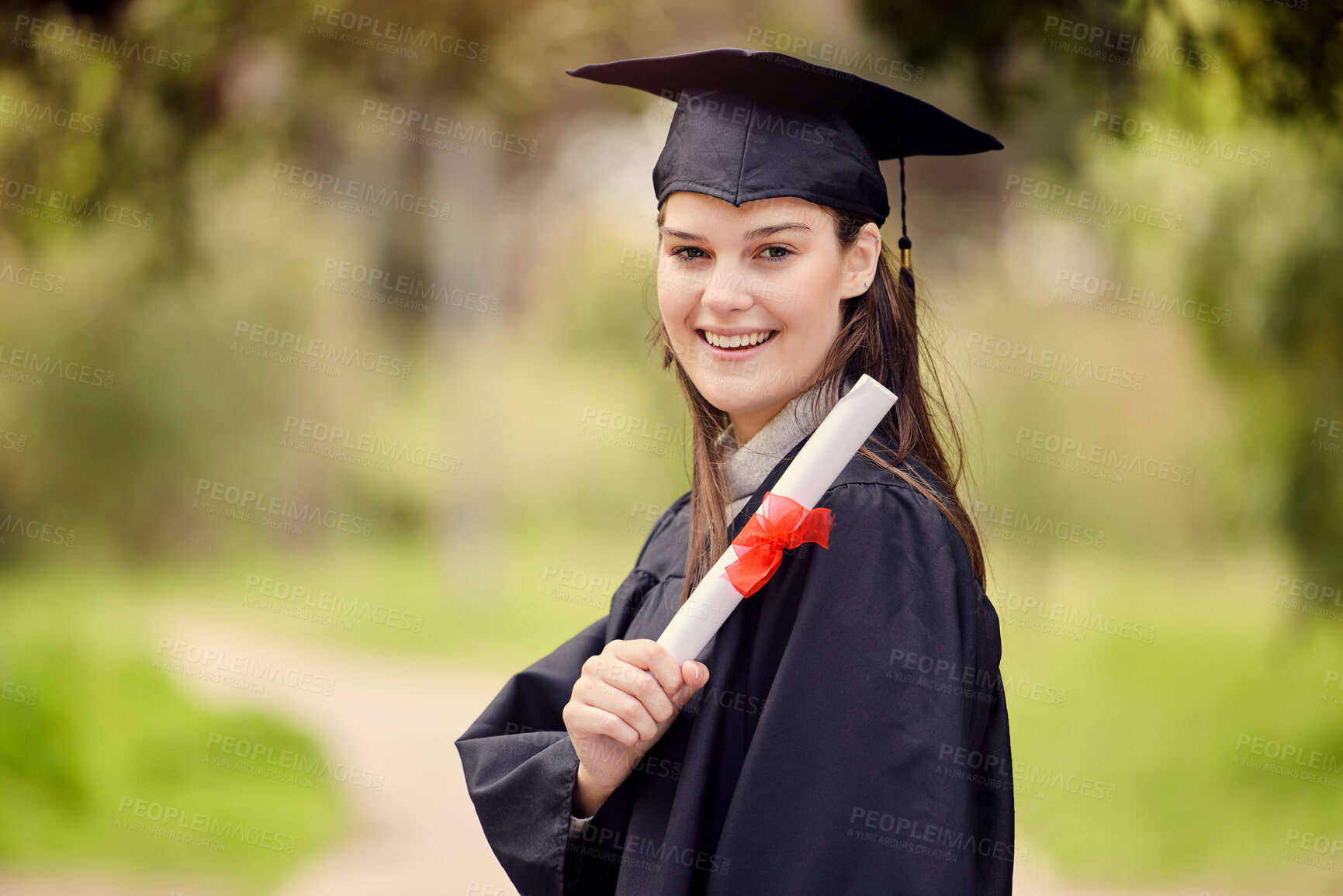 Buy stock photo Graduation, university and portrait of woman with diploma for education, achievement or success ceremony on campus. Student, bokeh and person with certificate for satisfaction, happiness or event