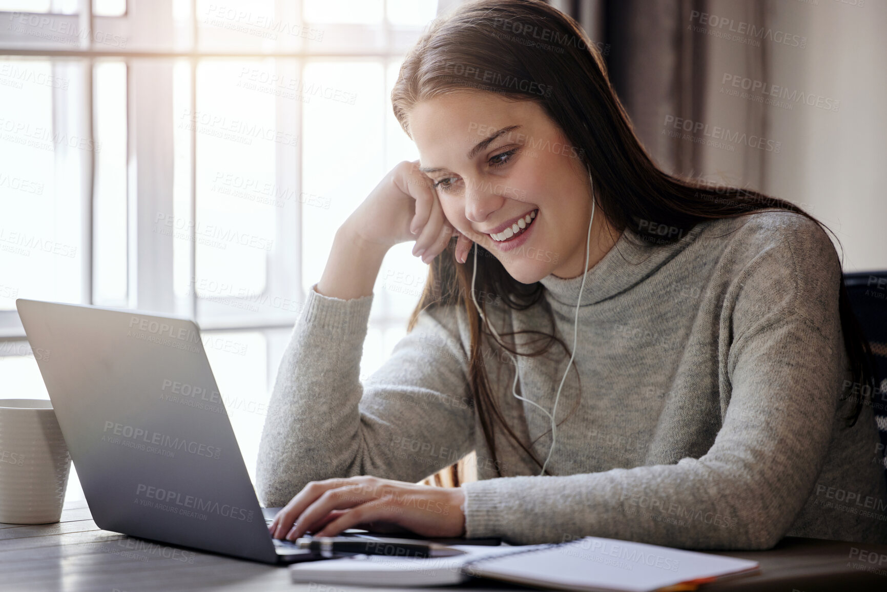 Buy stock photo Happy woman with laptop, earphones and video call at table in living room, elearning or webinar study. Smile, computer and college online class, girl with headphones at home for university education.