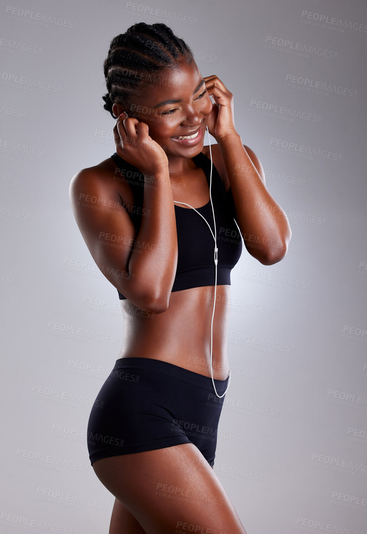 Buy stock photo Happy, woman and fitness with music, track or podcast for  exercise motivation and workout goals. Smile, sports and female person with earphones for listening to audio for training isolated in studio