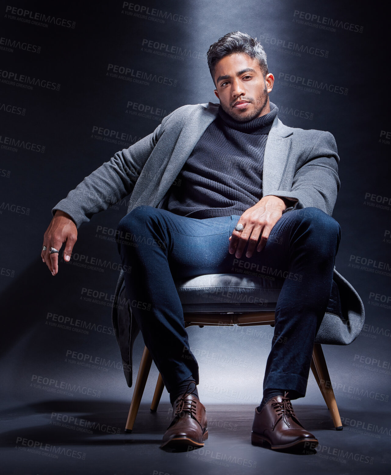 Buy stock photo Mafia, portrait and man with fashion in chair on studio, dark background or gangster with power. Serious, person and style with luxury jewellery, ring and criminal in mob or businessman with wealth