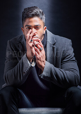 Buy stock photo Mafia, portrait and man with fashion in chair on studio, dark background or businessman with power. Serious, person and cool style with luxury jewellery, ring or criminal in mob or wealth of gangster