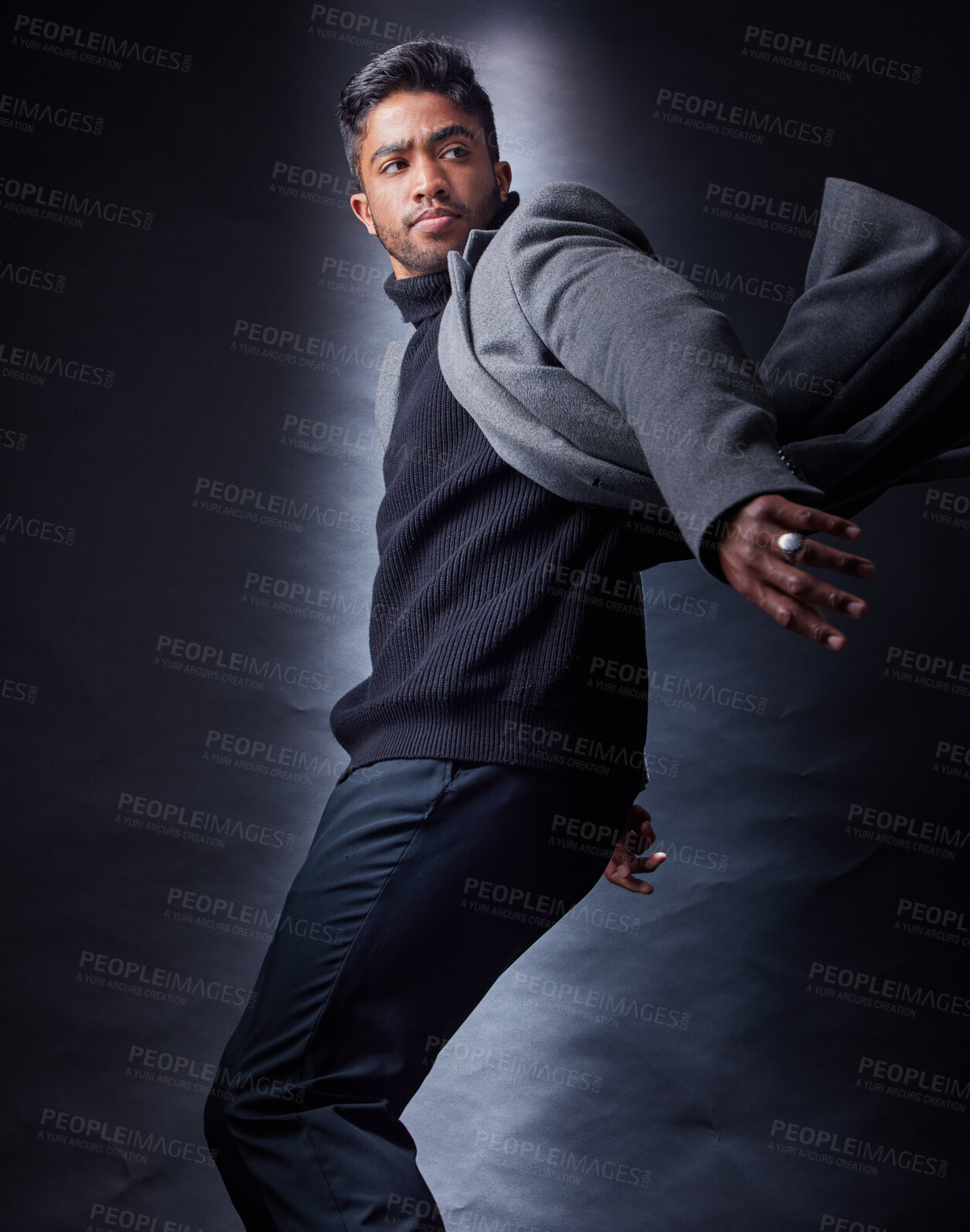 Buy stock photo Man, serious and fashion or black background, spy and coat with wind for escape and looking. Classy, semi formal and outfit or dark studio, male model and Indian person with trendy winter clothes