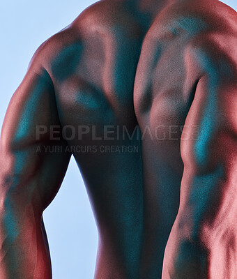 Buy stock photo Shot of a muscular man posing against a studio background