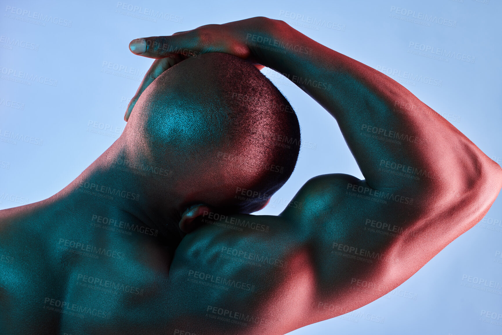 Buy stock photo Shot of a muscular man posing against a studio background