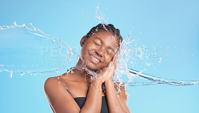 Buy stock photo Black woman, relax and splash of water in studio for cleaning face, hygiene and skincare beauty of hydrate glow. Smile, female person and natural facial, cosmetics and wellness on blue background