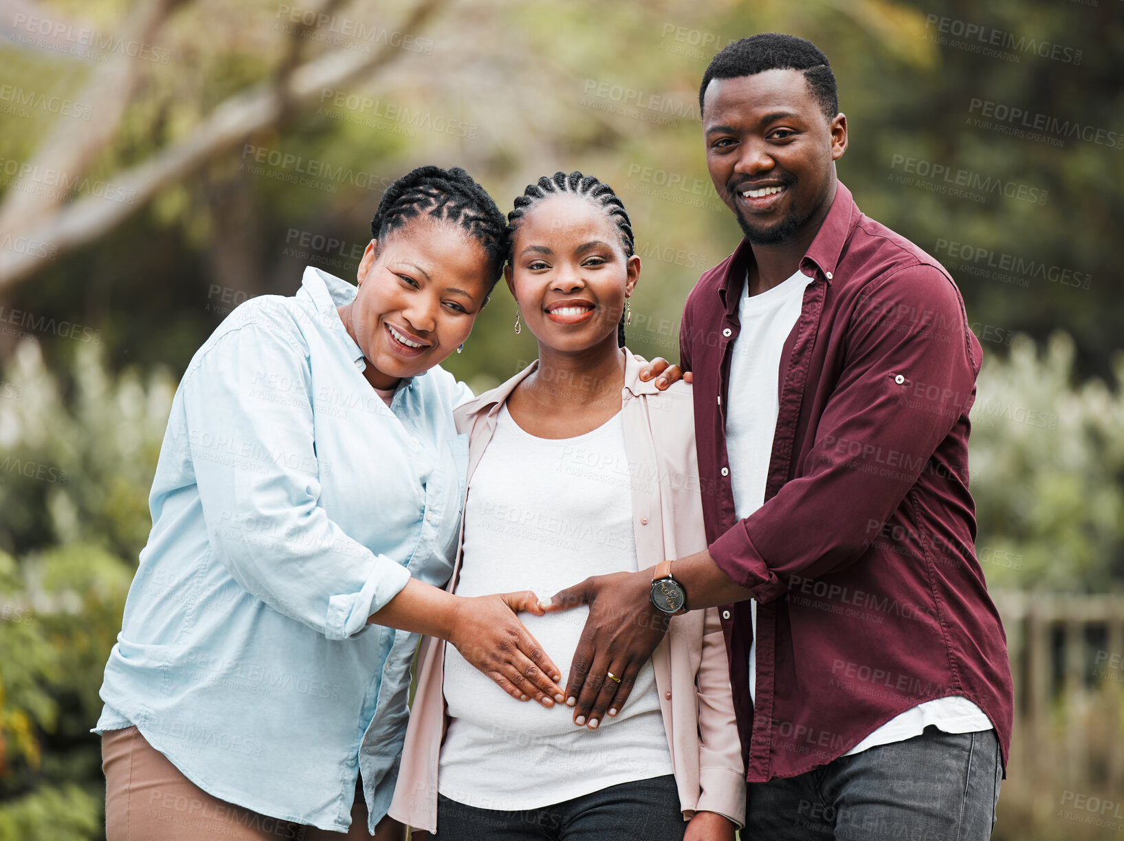 Buy stock photo Pregnant, woman and portrait of black family in nature for bonding, care and love of future child. Happy, mother and man with heart hands on belly for parenthood, support and security in growth