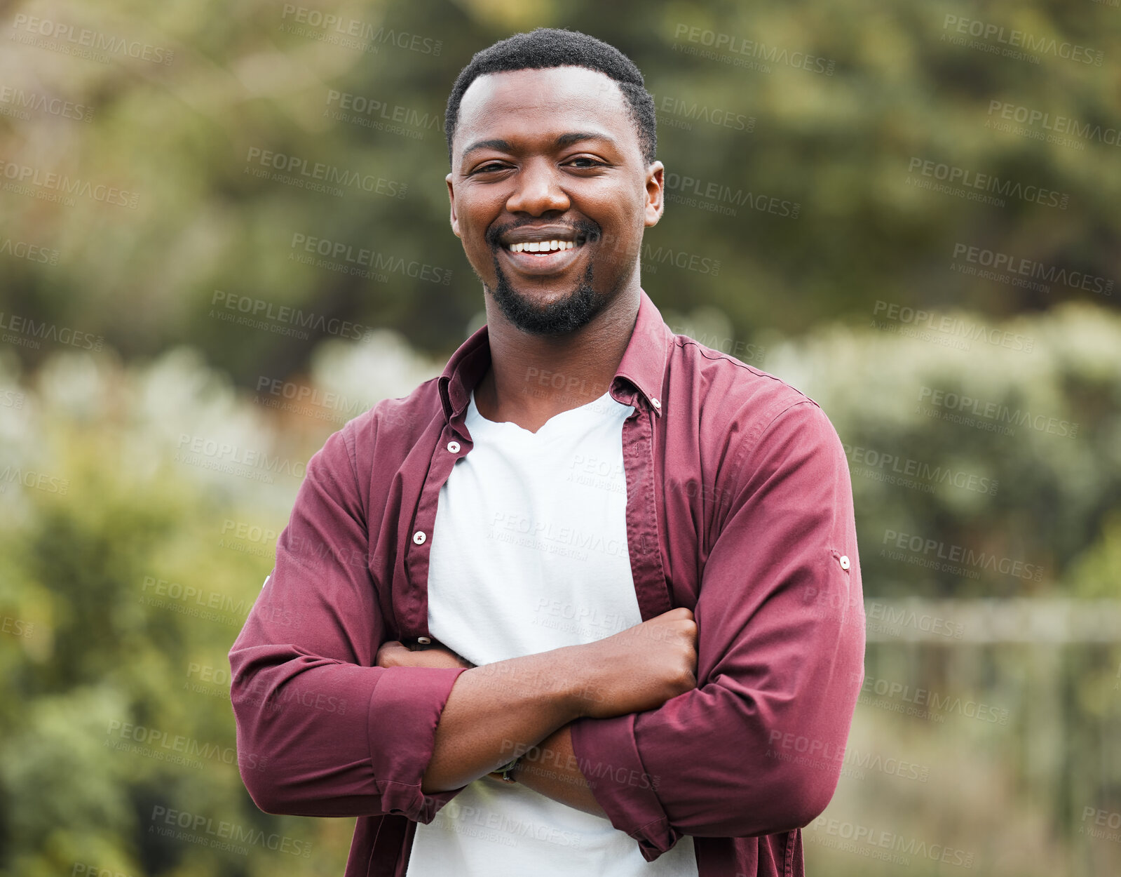 Buy stock photo Black man, portrait and outdoor with arms crossed in garden, forest and countryside in Nigeria. Male person, travel and nature for peace on vacation, weekend trip and woods for happy calm on getaway