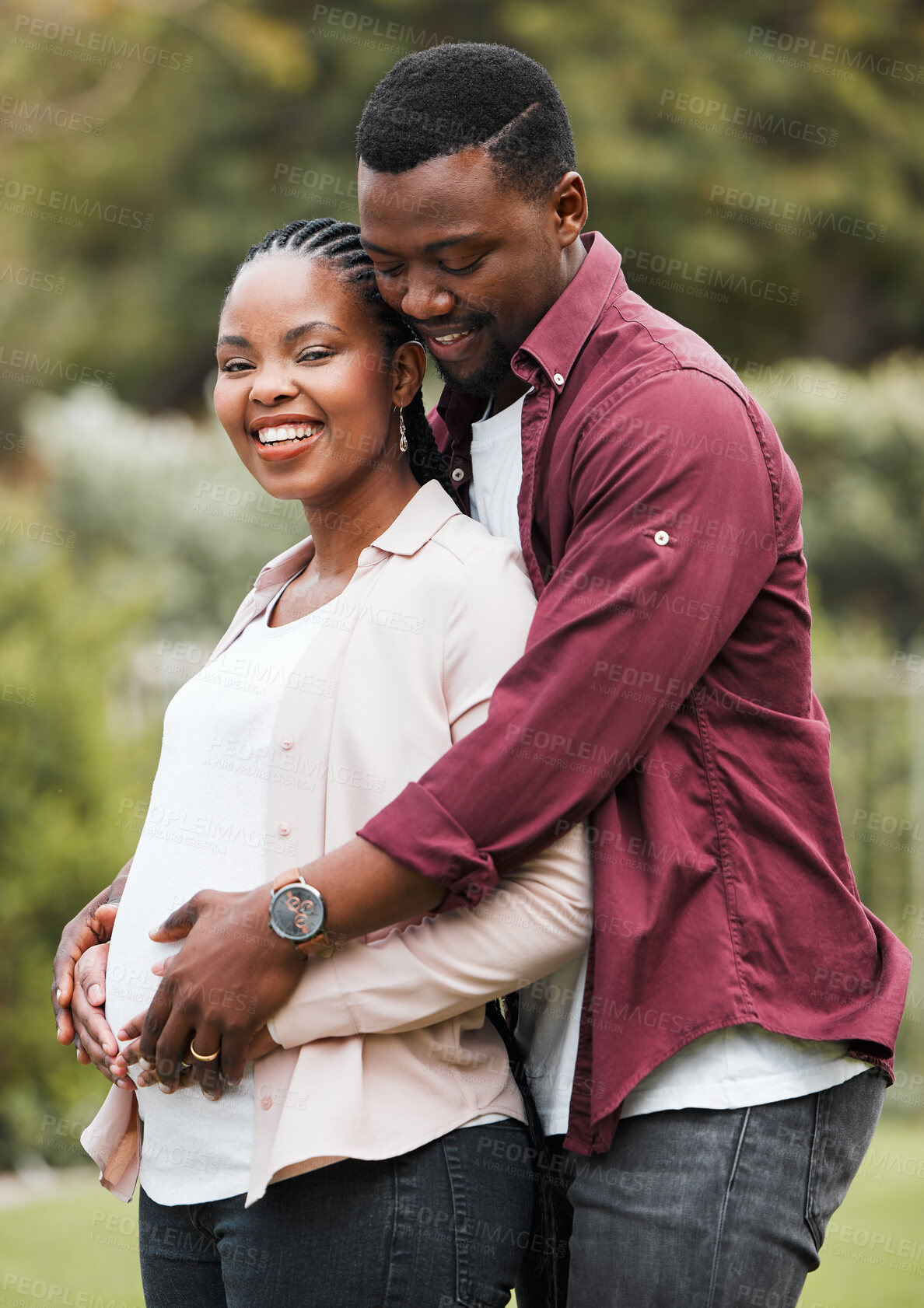 Buy stock photo Black couple, bonding and smile outdoor for pregnancy, marriage and relationship with stomach growth. Man, happy and hug pregnant woman in home backyard for love, support and maternity in Nigeria