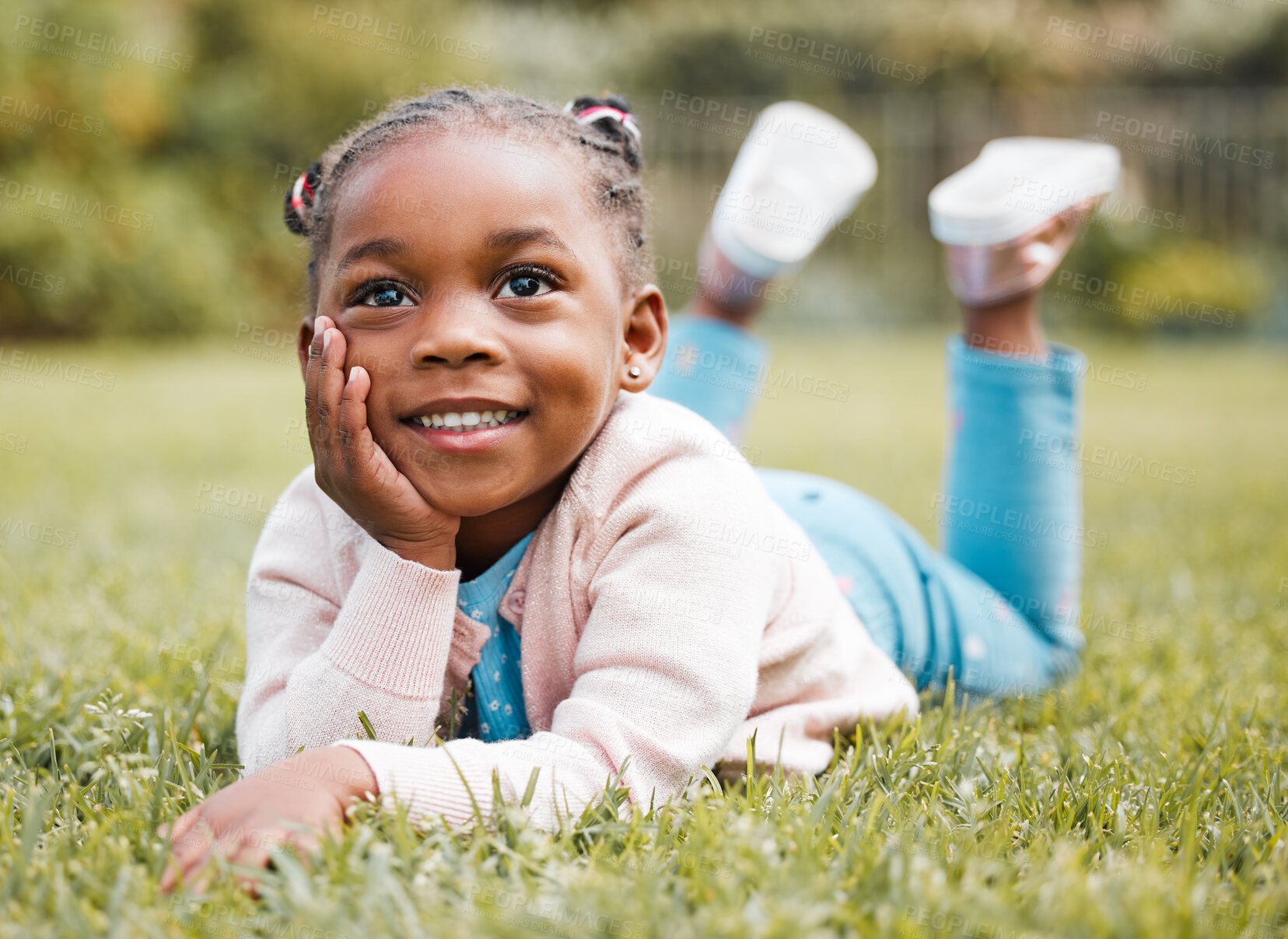 Buy stock photo African girl, kid and lying on lawn for thinking, smile and relax with vacation, picnic and outdoor in nature. Child, happy and memory on grass in backyard, ideas and growth with sunshine in Kenya