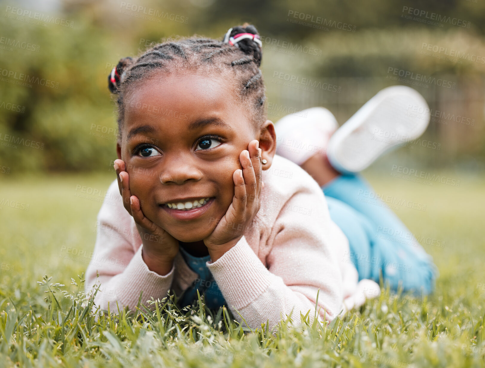 Buy stock photo African girl, kid and lying on grass for thinking, smile and relax with vacation, picnic and outdoor in nature. Child, happy and memory on lawn in backyard, playful and growth with sunshine in summer