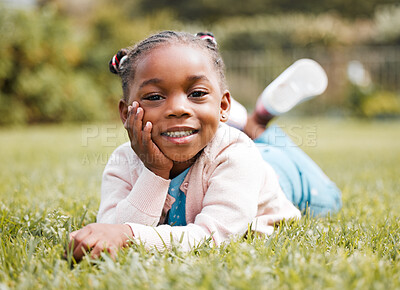Buy stock photo Shot of a little girl happily spending time alone in her family garden