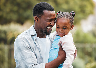 Buy stock photo Shot of a young man spending time with his daughter in their garden