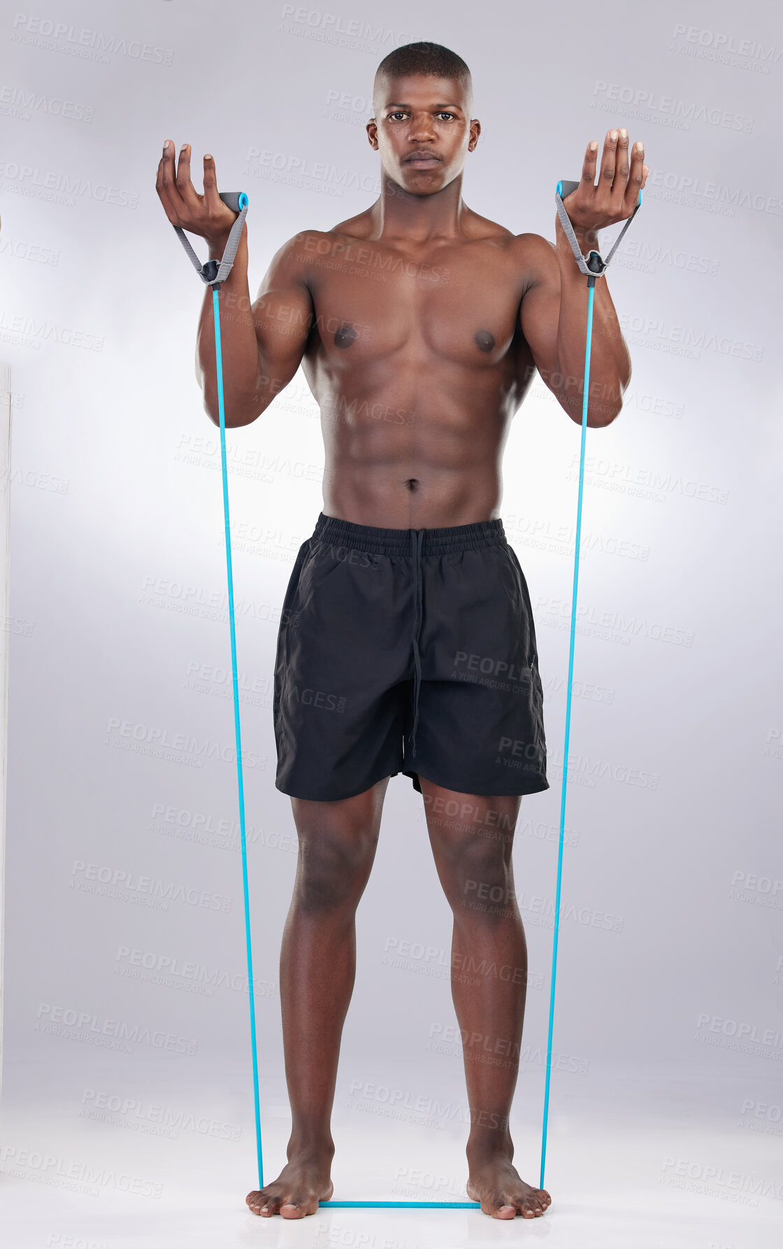 Buy stock photo Black man, resistance band and exercise in studio portrait for wellness, progress or development by white background. Person, bodybuilder and strong in workout, fitness and training for healthy body