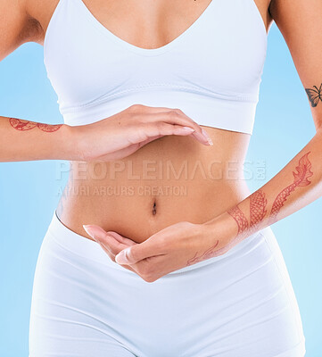 Buy stock photo Shot of an unrecognizable woman forming a frame with her hands over her stomach