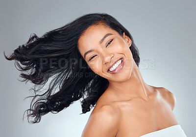 Buy stock photo Portrait, smile and happy woman in studio for hair, beauty and cosmetics against grey background space. Face, beauty and female aesthetic model satisfied with haircare treatment, volume and texture